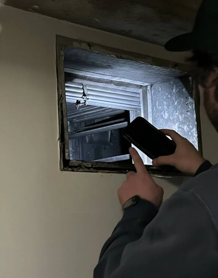 Close-up inspection of smoke damper and duct system